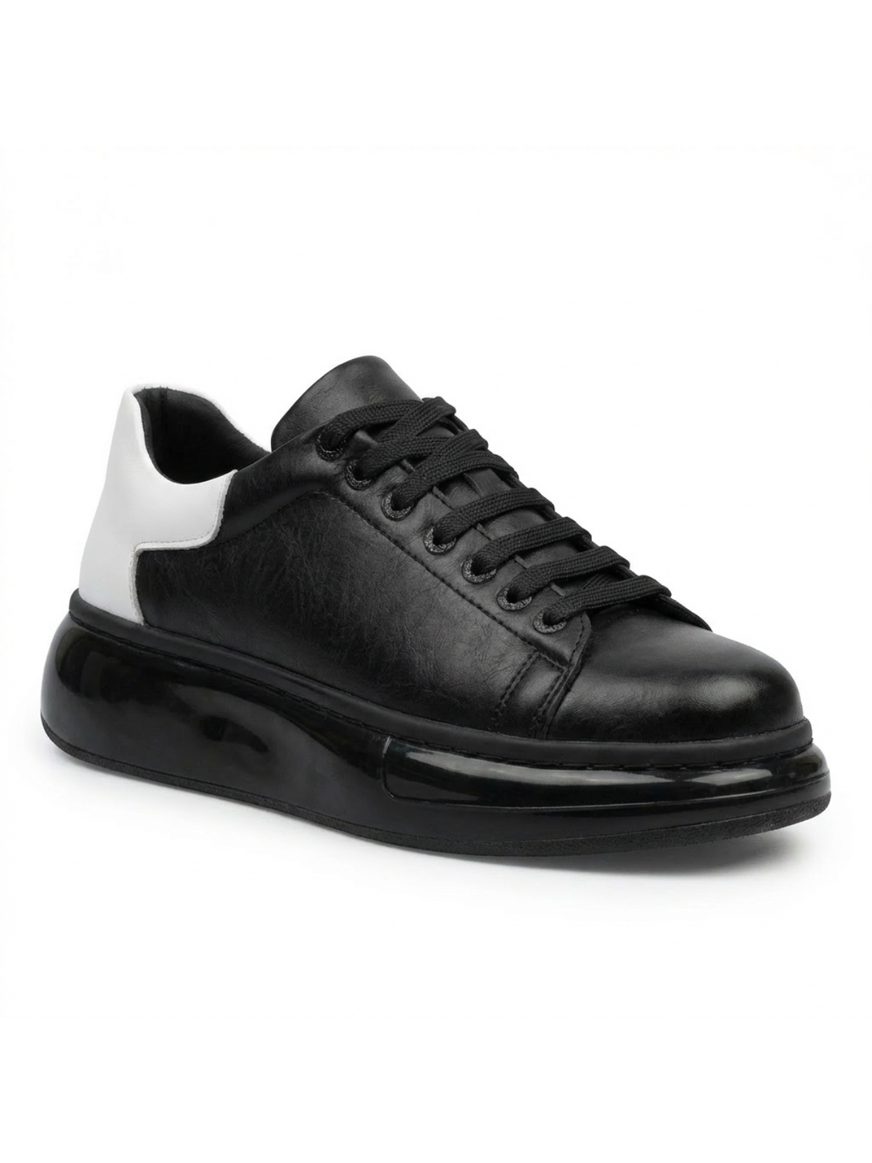 Black sneaker with white heel on a white background
