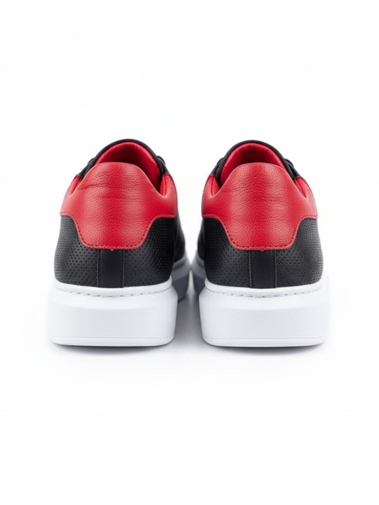 Men's Pluto Noir by Apollo Moda, black leather low-top sneaker with red accents, third angle